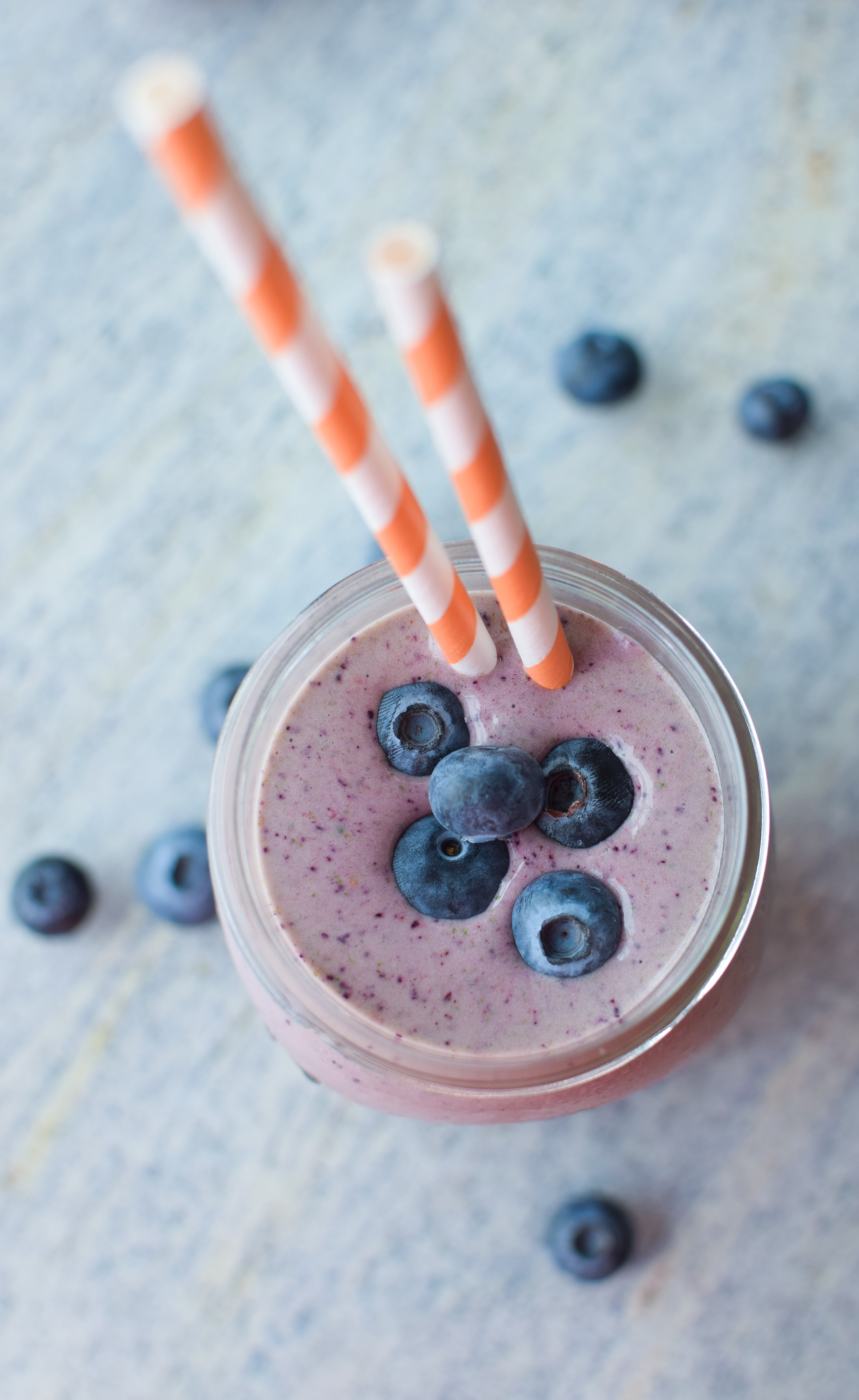 Our very favorite go-to Berry Protein Smoothies recipe in two ways! Packed with berries, greens, and protein, and super easy for meal prepping! - ProjectMealPlan.com