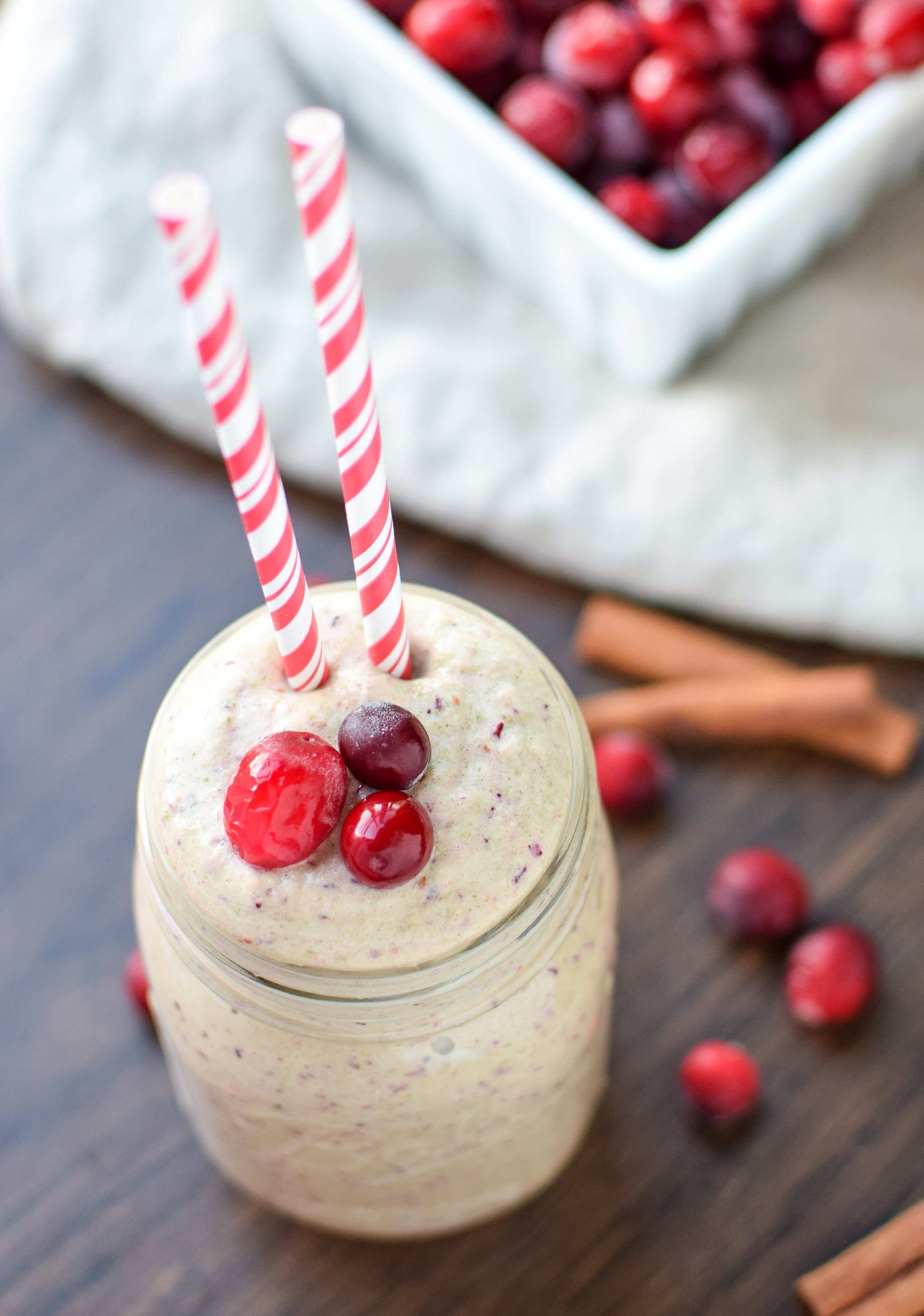 Orange Cranberry Greens Protein Smoothie recipe - You MUST try this new smoothie with happy Fall flavors - orange, cranberry, and CINNAMON make this creamy breakfast (or lunch!) complete! - ProjectMealPlan.com