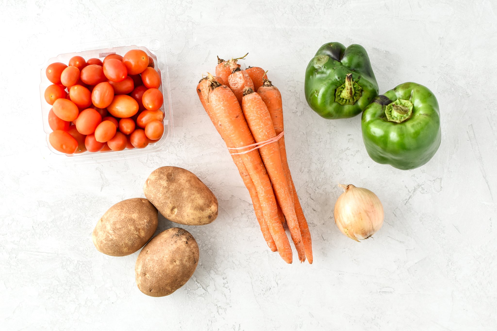 Simple, healthy, Meal Prep Italian Seasoned Chicken with Roasted Imperfect Vegetables including potatoes, cherry tomatoes, onions, and bell peppers!