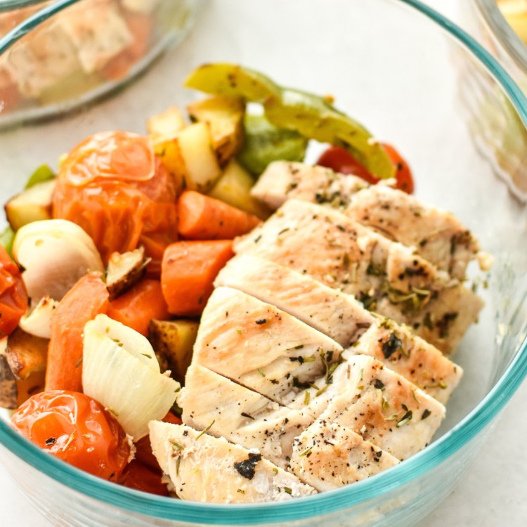 Simple, healthy, Meal Prep Italian Seasoned Chicken with Roasted Imperfect Vegetables including potatoes, cherry tomatoes, onions, and bell peppers!
