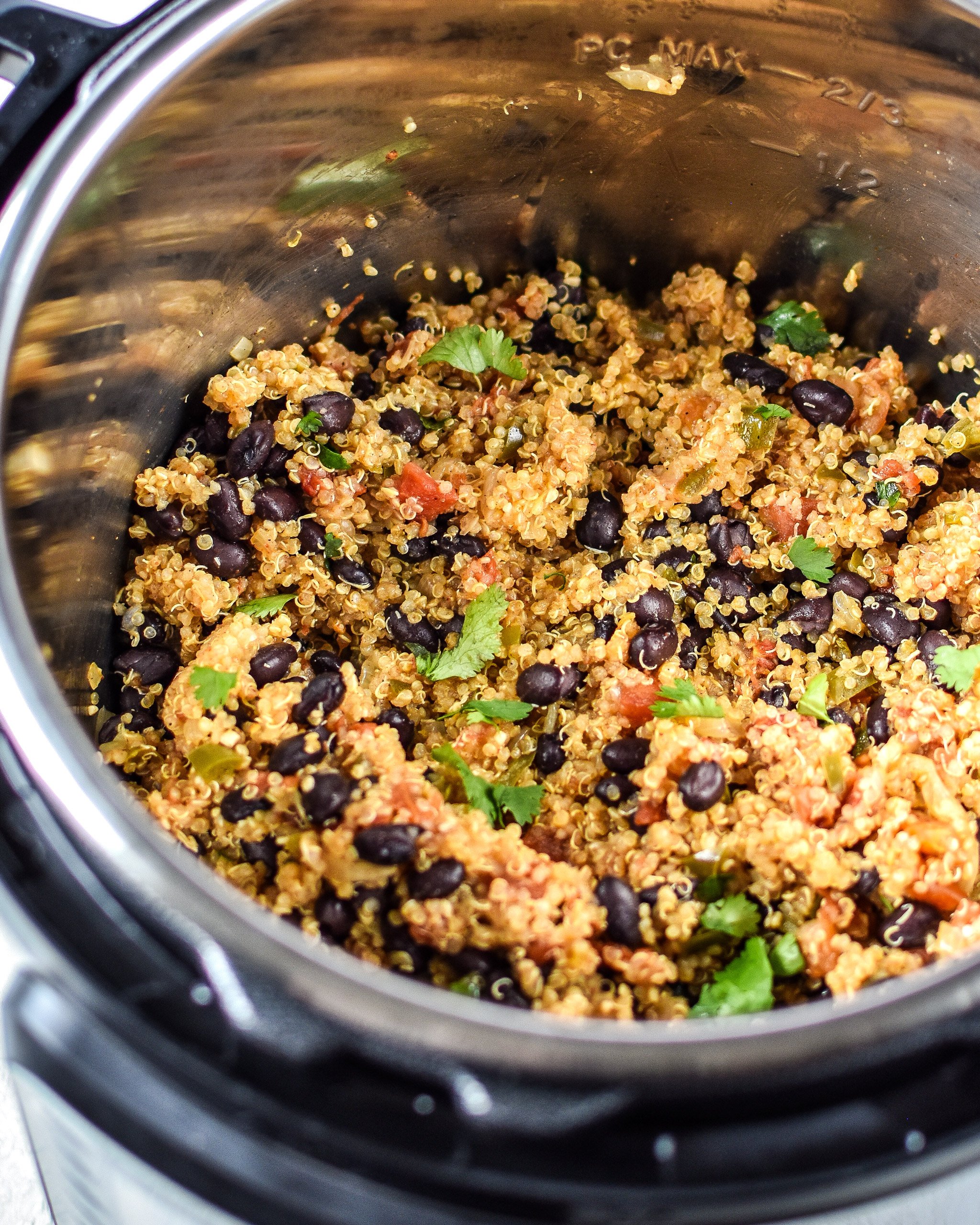 Cooked Mexican quinoa with black beans and cilantro in an Instant Pot.