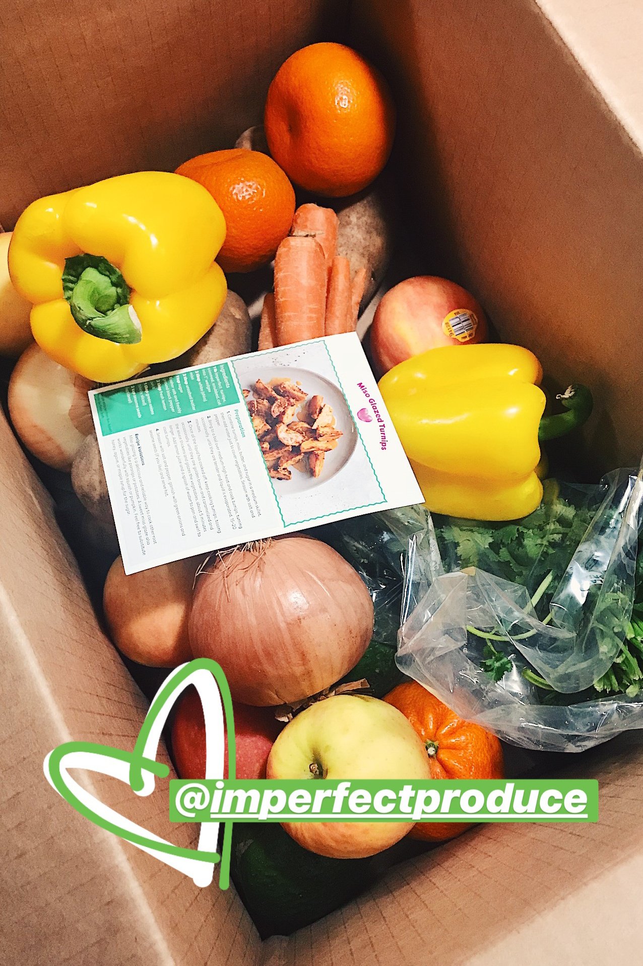 A box of produce from Imperfect Produce. It's important to plan around what food you already have before purchasing new.