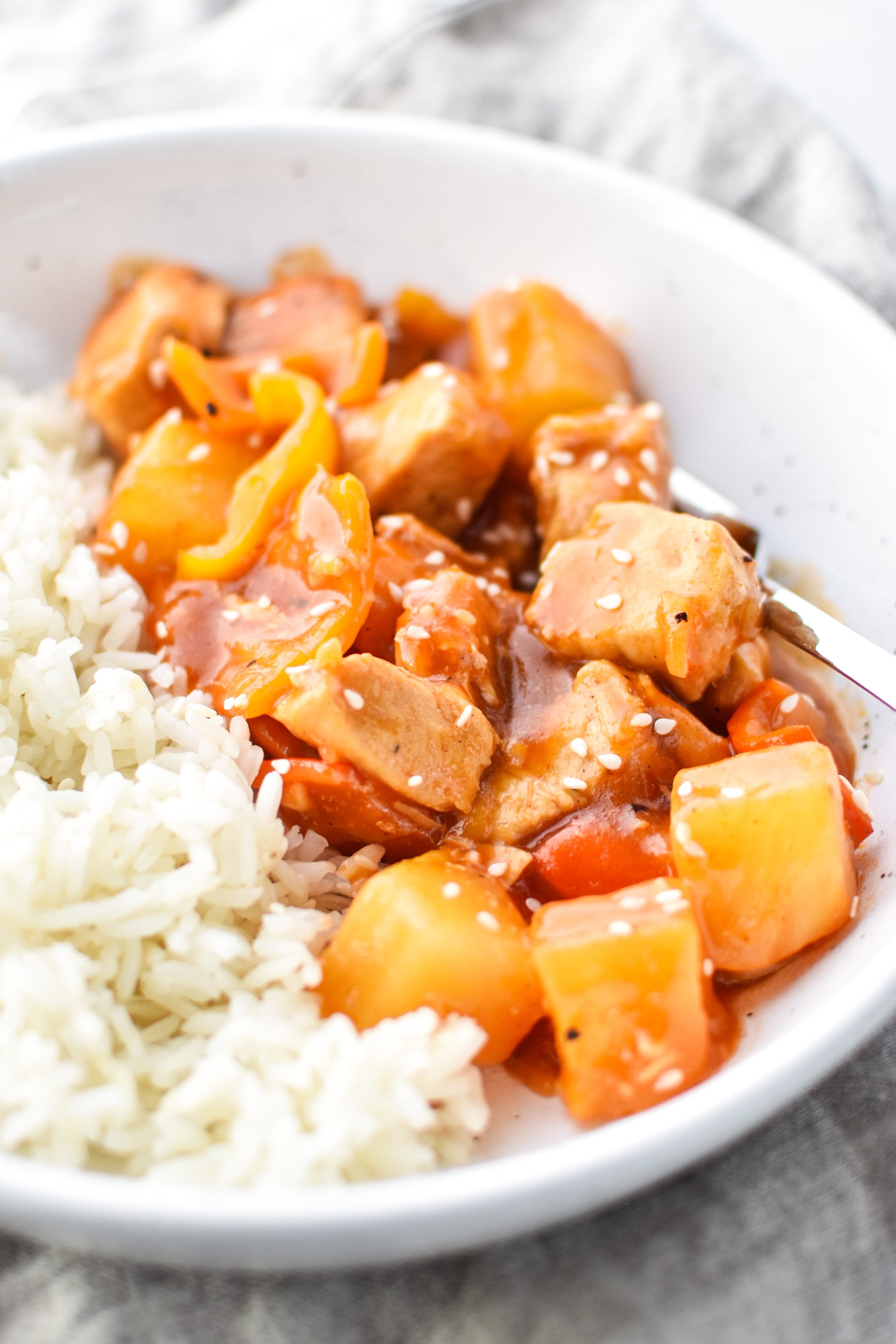 Bowl of Sweet Ginger BBQ Chicken Meal Prep from the side with rice.