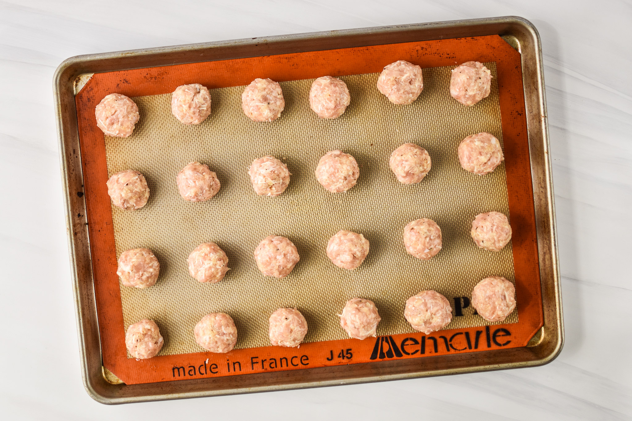 Raw meatballs ready to be cooked for the Chicken Meatballs Two Ways Meal Prep Lunches