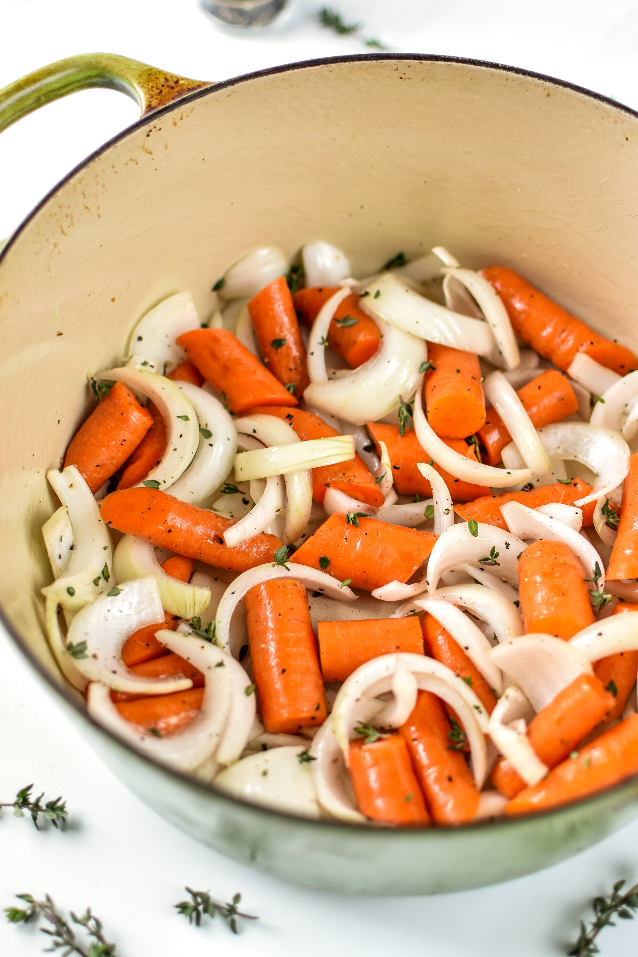 the roasting pan prepped with vegetables for the simple whole roast chicken