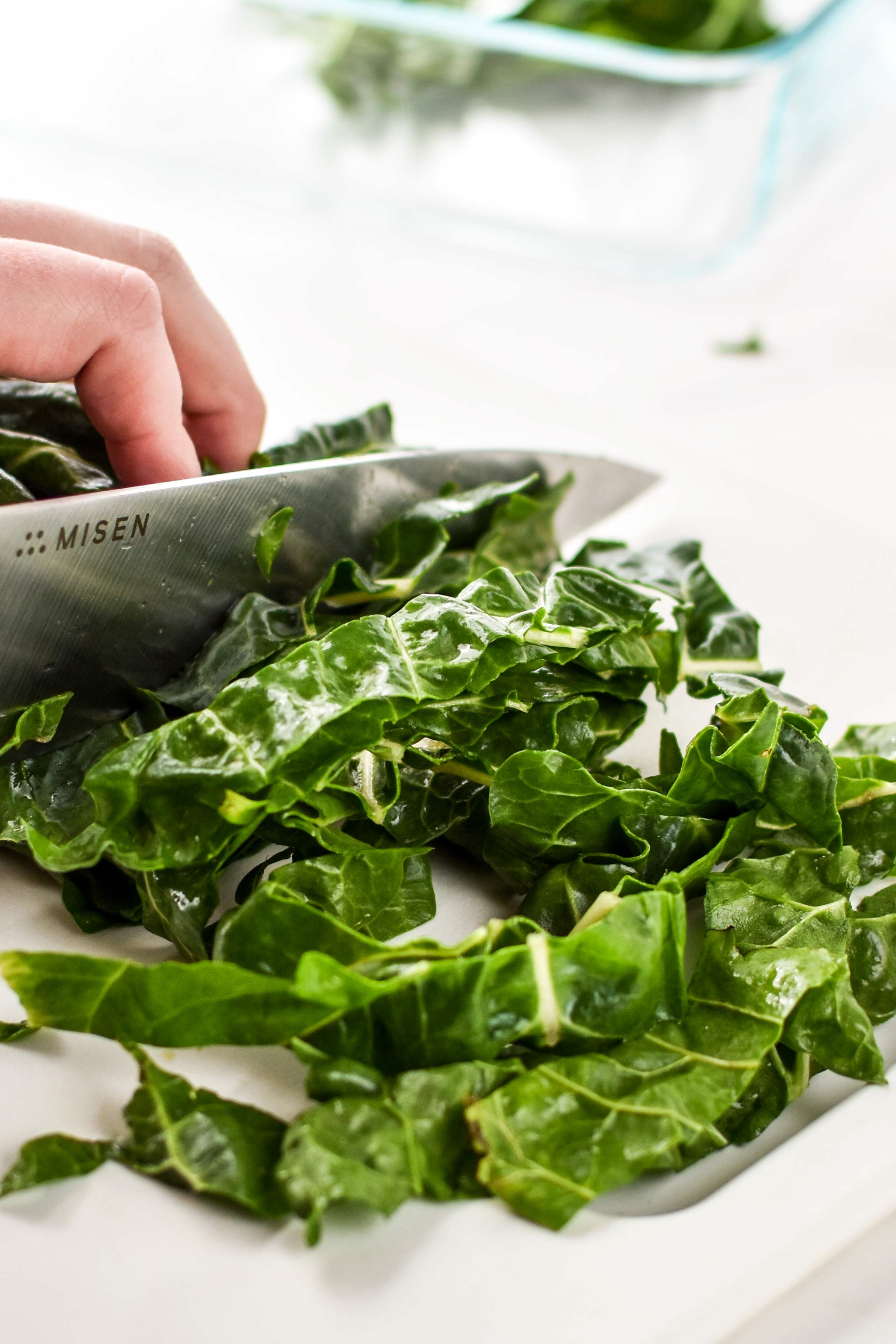 slicing swiss chard for veggie packed breakfast fried rice