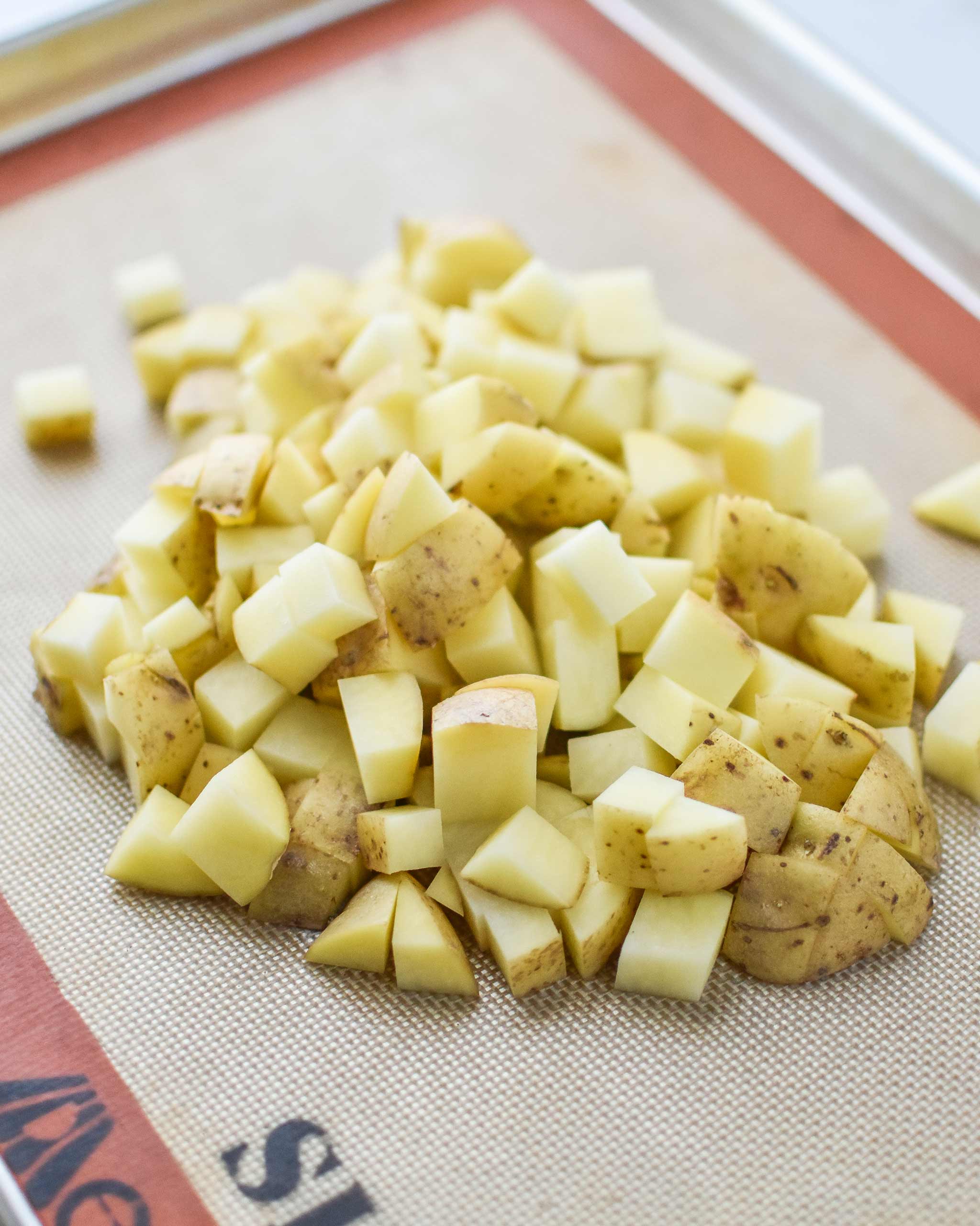 diced yukon gold potatoes on a sheet pan