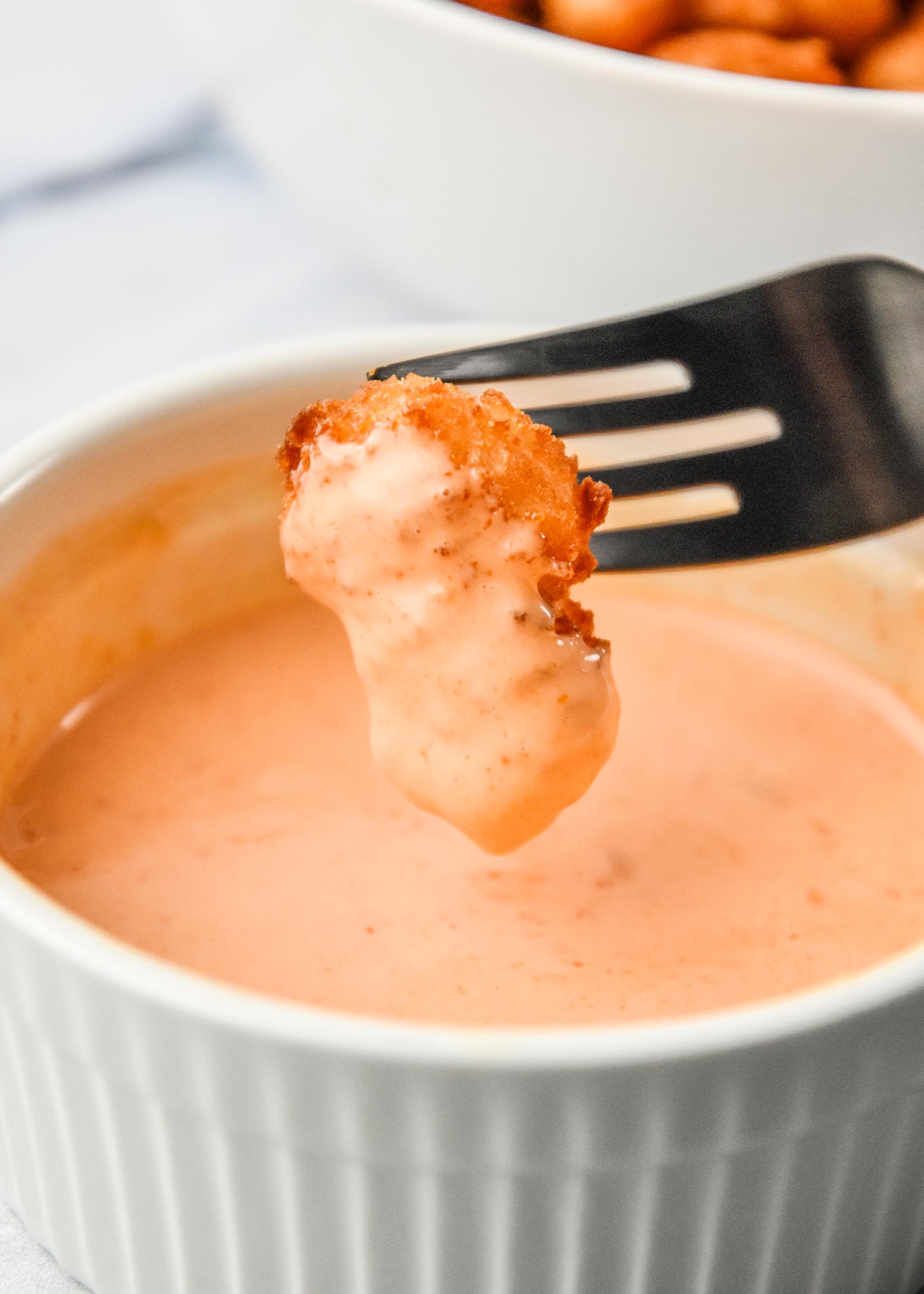 air fryer popcorn shrimp dipped in sauce