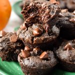 pumpkin spice brownie bites on a plate, one with a bite taken out