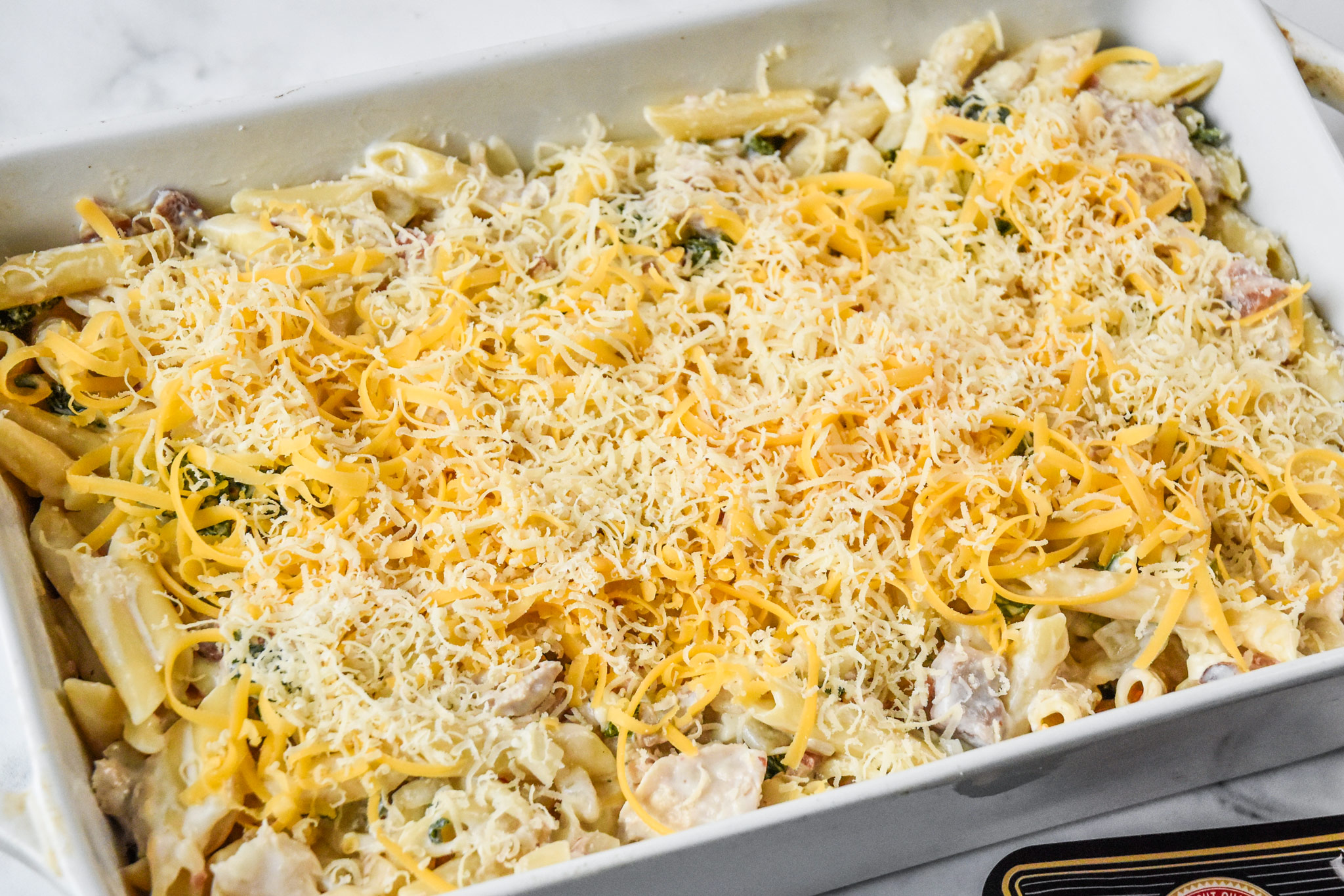 cheesy chicken bacon ranch kale casserole before baking