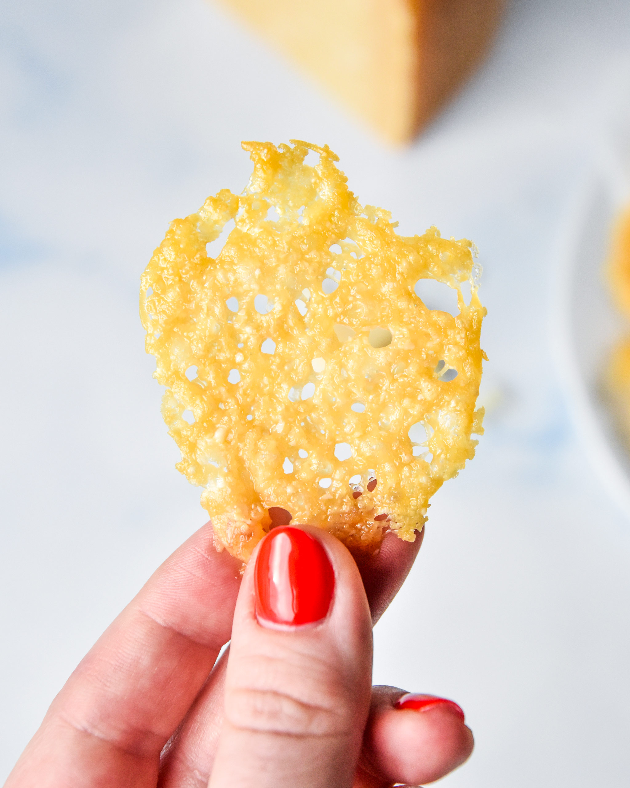 holding a baked parmesan crisp