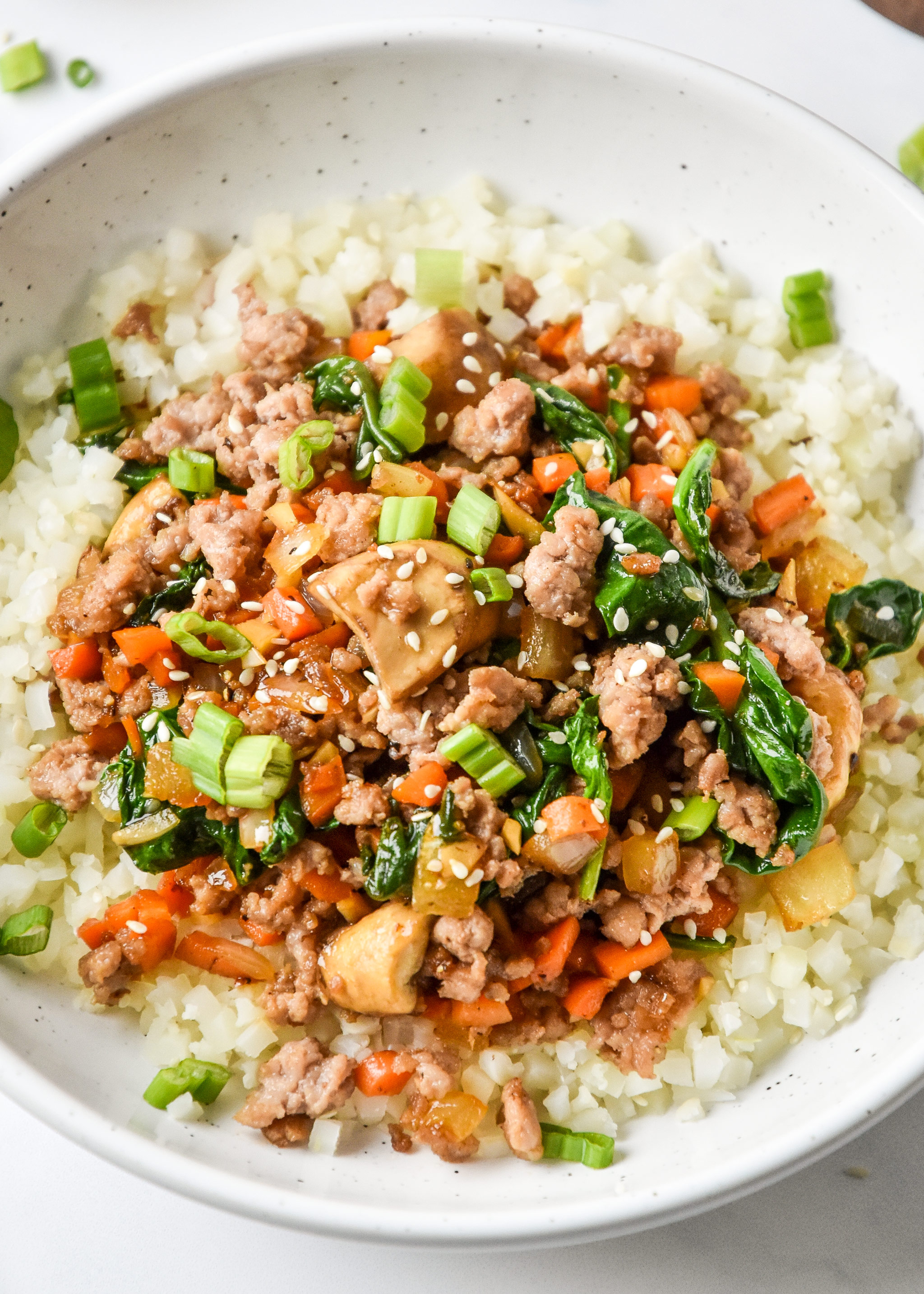 one serving vegetable pork bowl close up with cauliflower rice