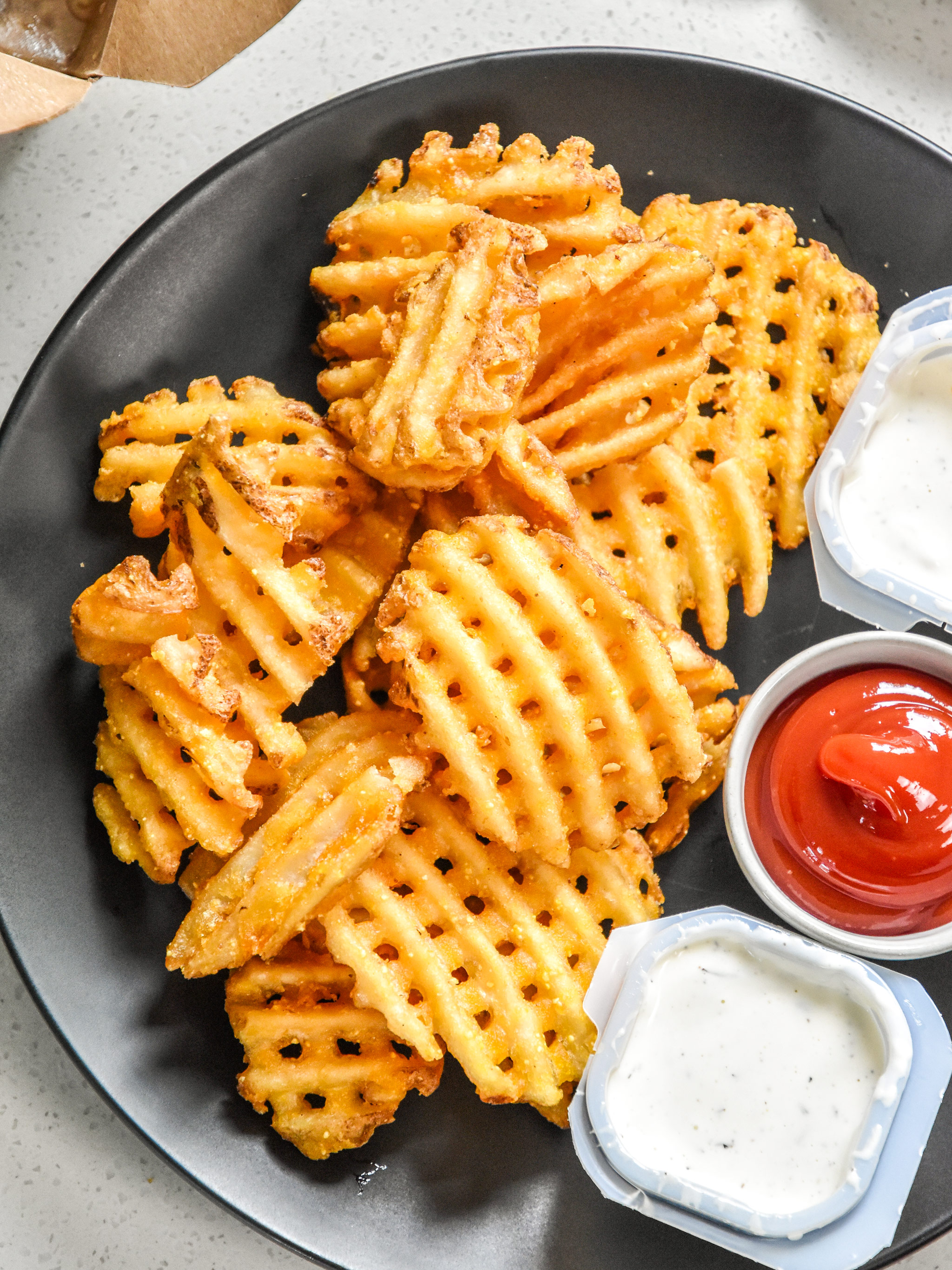 how to reheat fries in an air fryer on a plate served with sauce