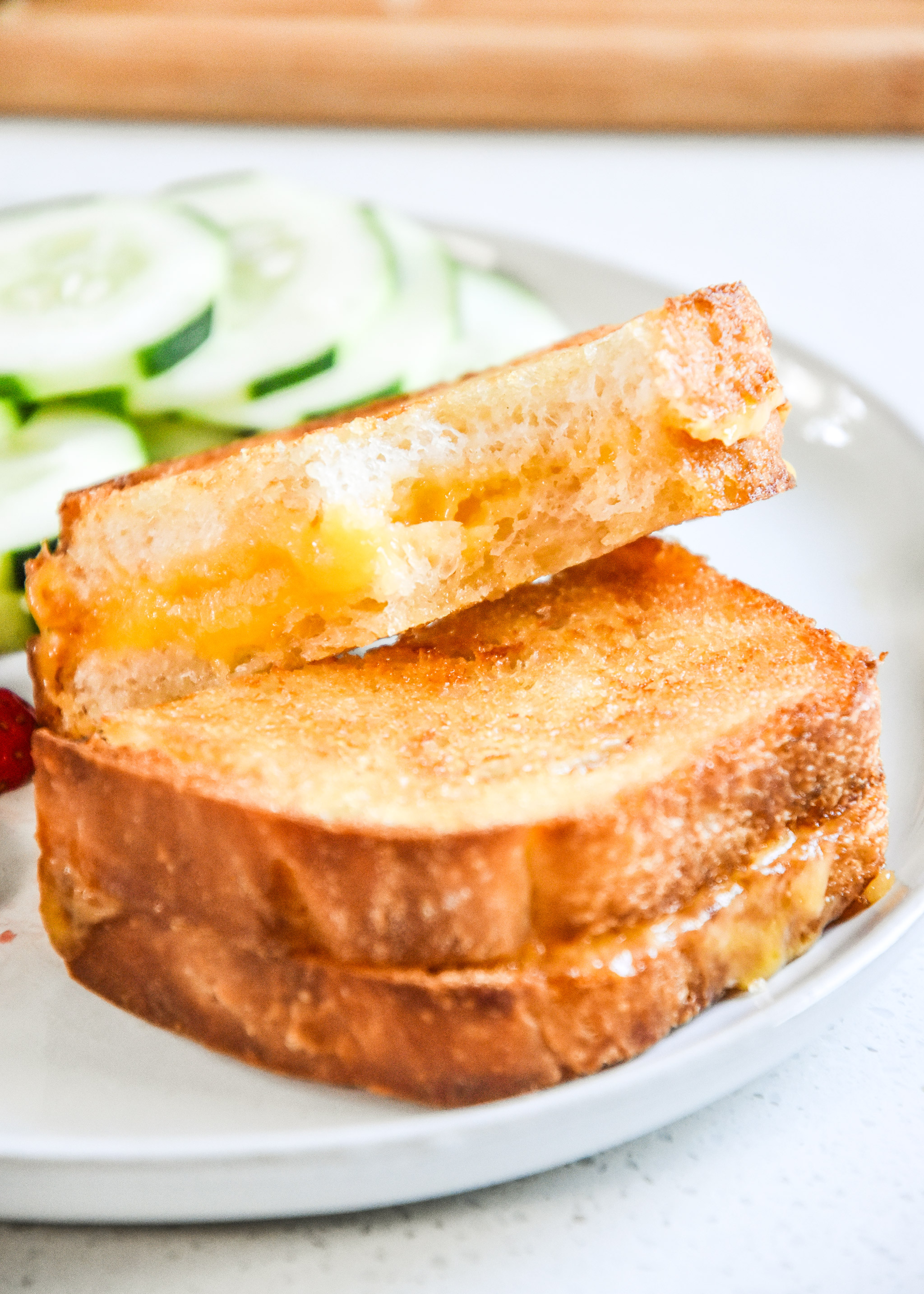 air fryer grilled cheese sandwich with a bite out of it