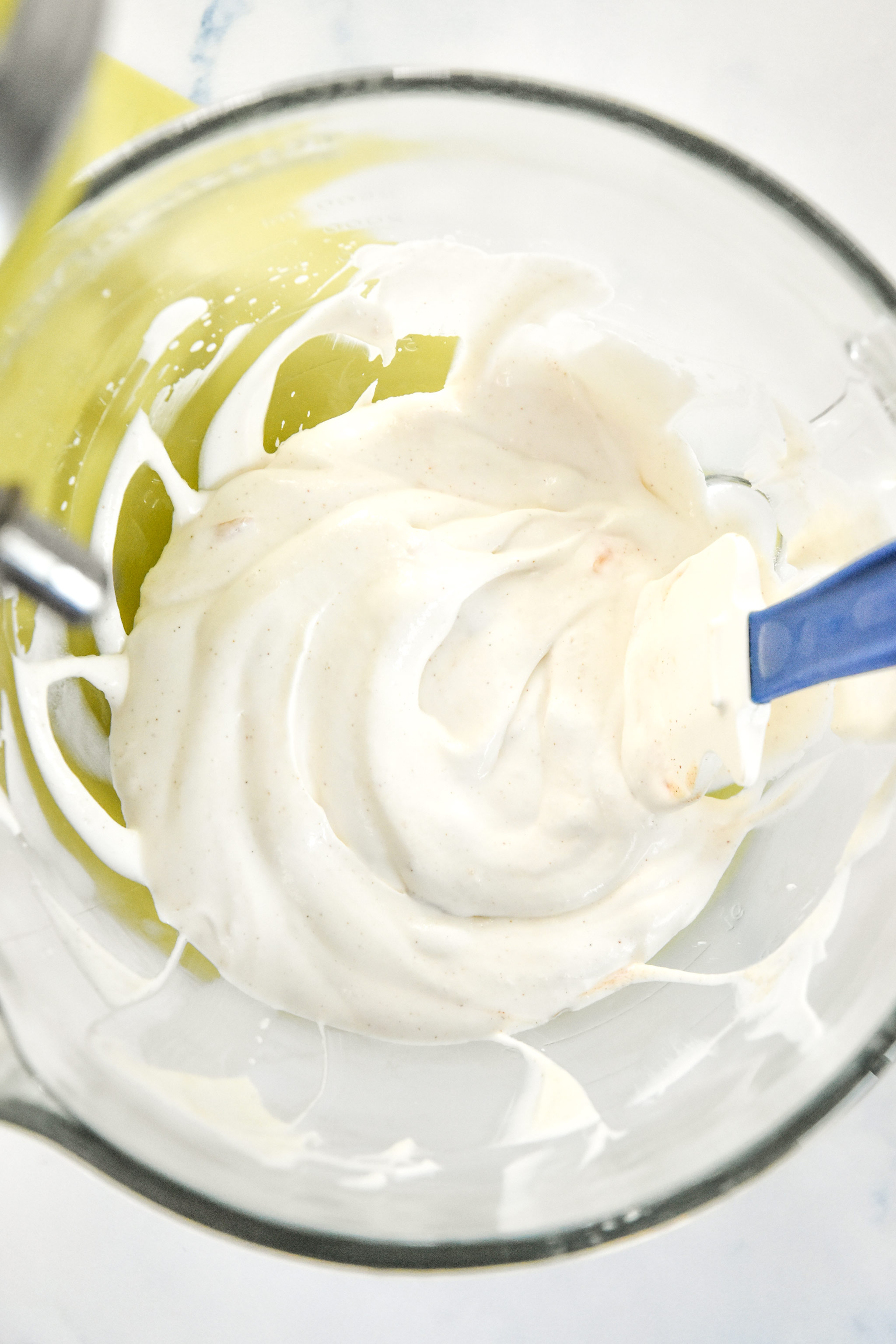 whipped greek yogurt in a mixing bowl.