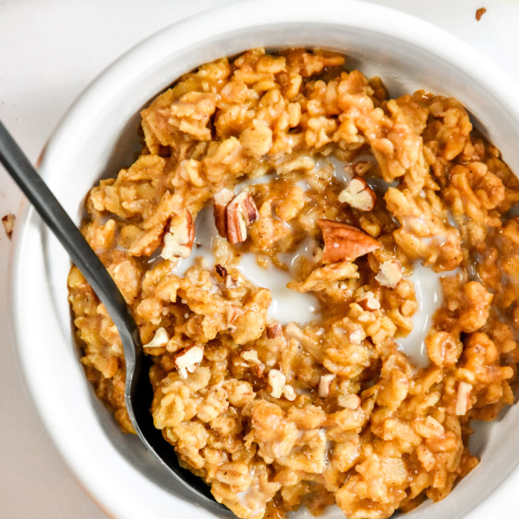bowl of instant pot pumpkin spice oatmeal with some almond milk