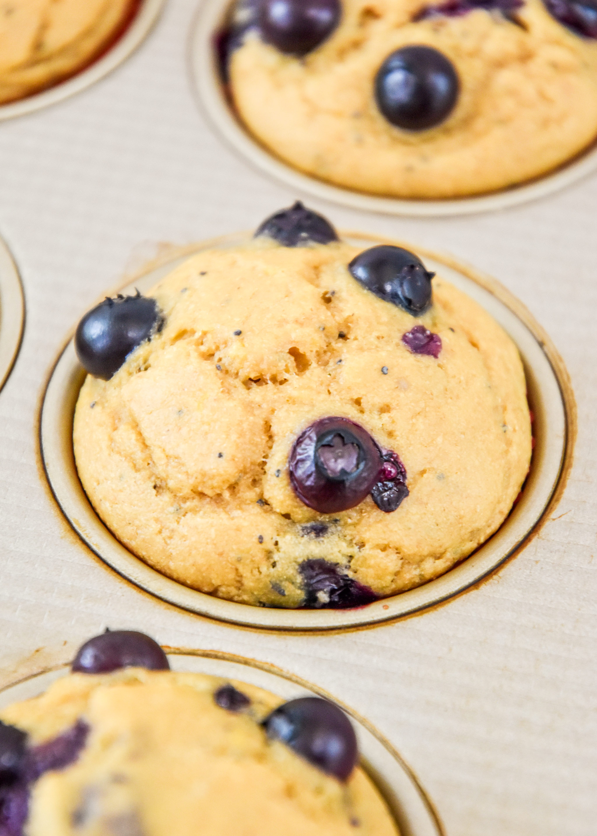 close up of cooked blueberry lemon pancake mix muffins.