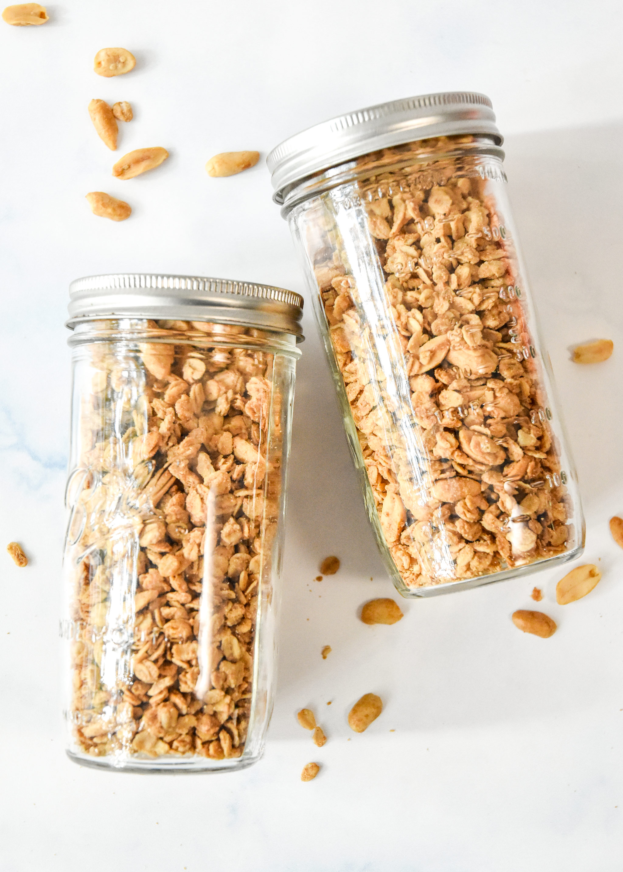 easy peanut butter granola in two large mason jars.