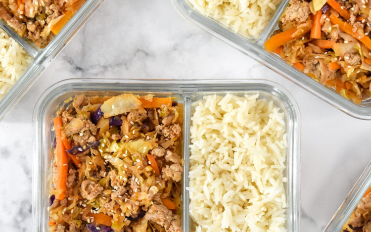 spicy ground turkey cabbage stir fry meal prep in a glass meal prep container.
