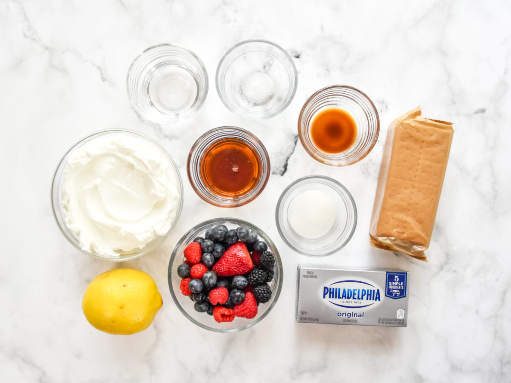 ingredients on a counter top for making the no-bake cheesecake Greek yogurt cups.