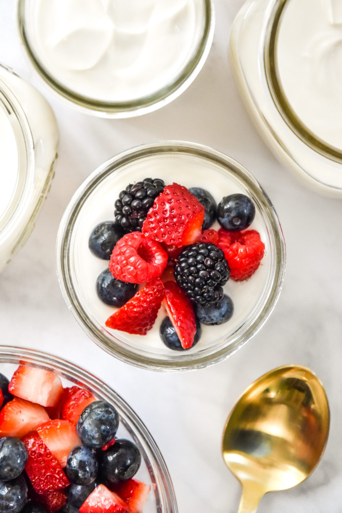 berries on top of the no-bake cheesecake yogurt cups.