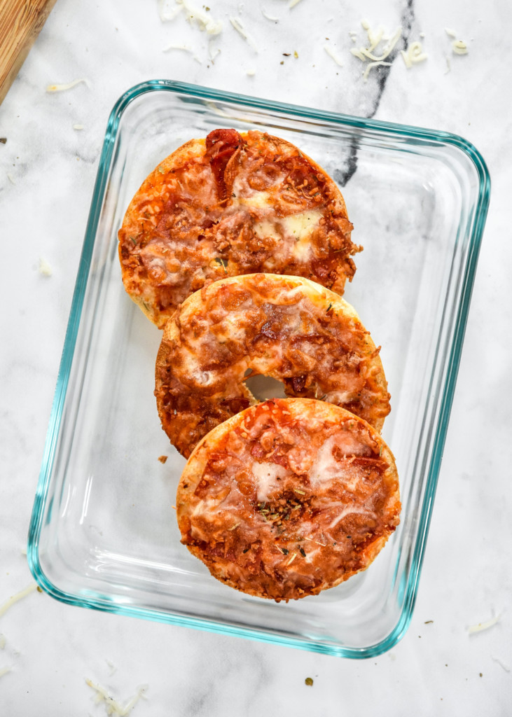 leftover pizza bagel bites in a glass pyrex container.