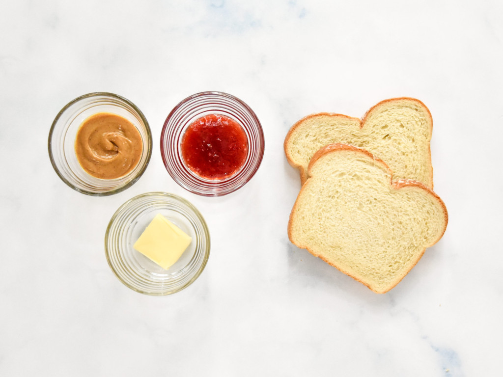 ingredients to make the air fryer peanut butter and jelly sandwich.