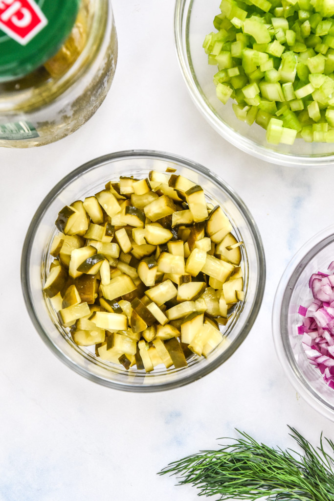 diced pickles in a glass bowl.