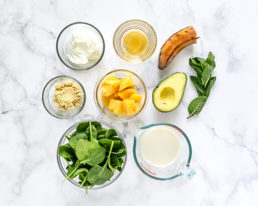 ingredients in glass bowls to make the creamy avocado mint green smoothie.
