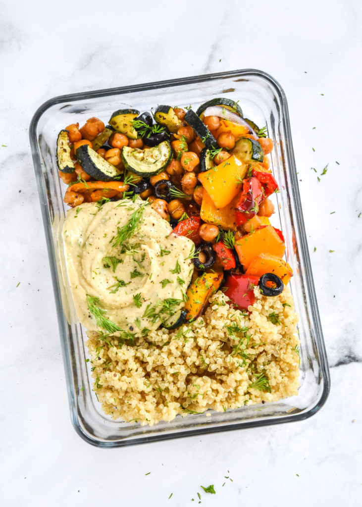 a mediterranean inspired grain bowl meal prep with lemon dill hummus and more fresh dill on top.