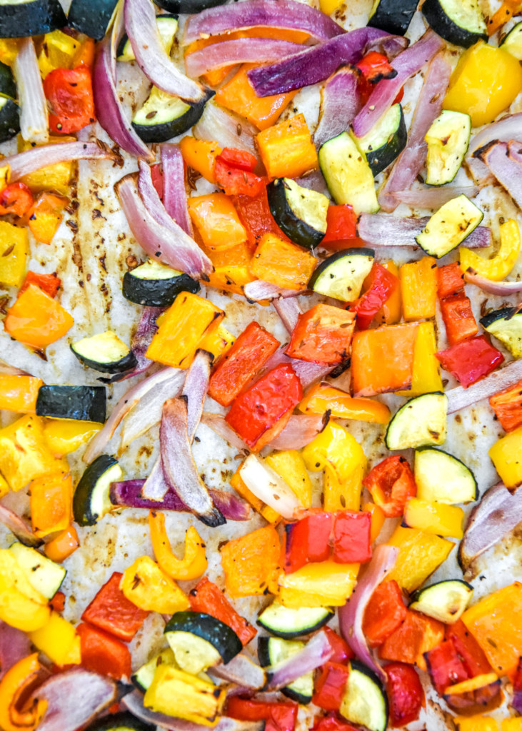 roasted seasoned vegetables on a sheet pan.