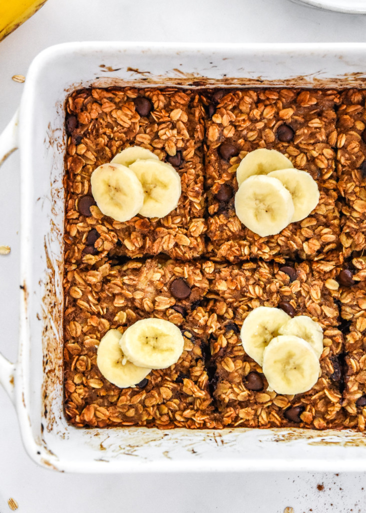 chocolate chip banana bread baked oatmeal fresh baked with sliced bananas on top.