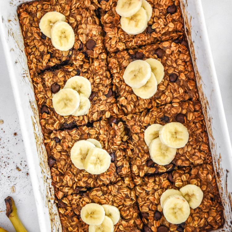 chocolate chip banana bread baked oatmeal fresh baked in a white casserole dish.