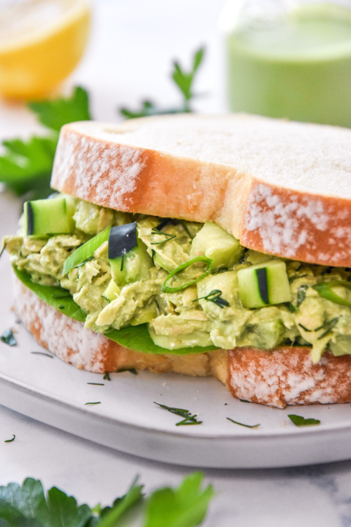 green goddess tuna salad sandwich on white bread.