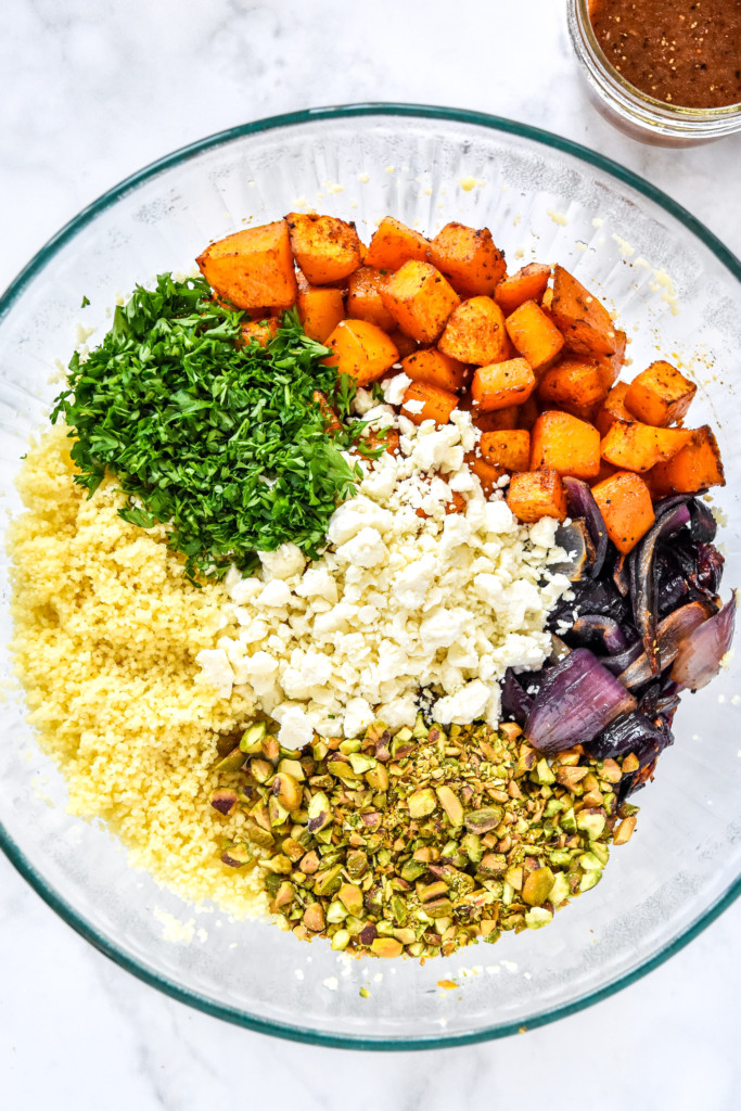 all ingredients to make the roasted butternut squash couscous salad before mixing together.