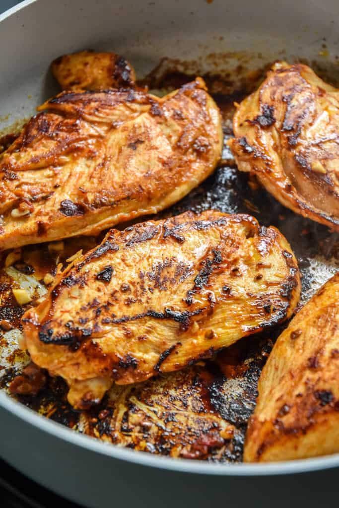 chipotle lime chicken cooking in a pan for the chipotle lime chicken meal prep.