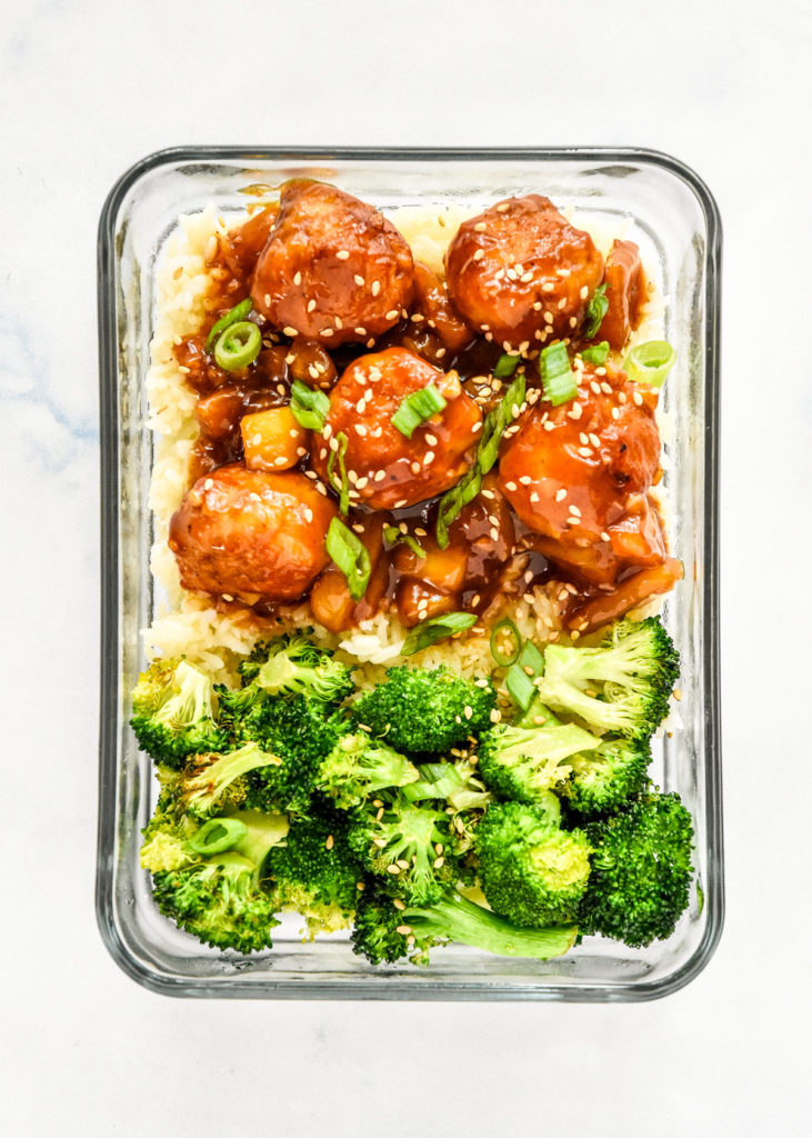 homemade pineapple teriyaki chicken meatballs with broccoli and rice in a meal prep container.
