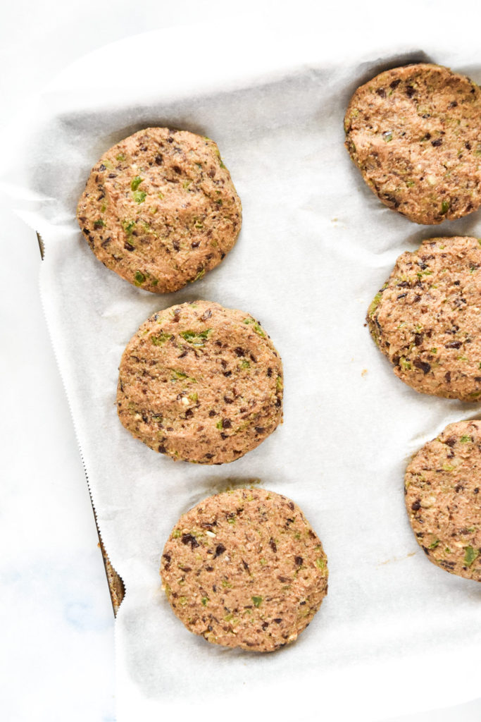 formed black bean burger patties in a small tray.