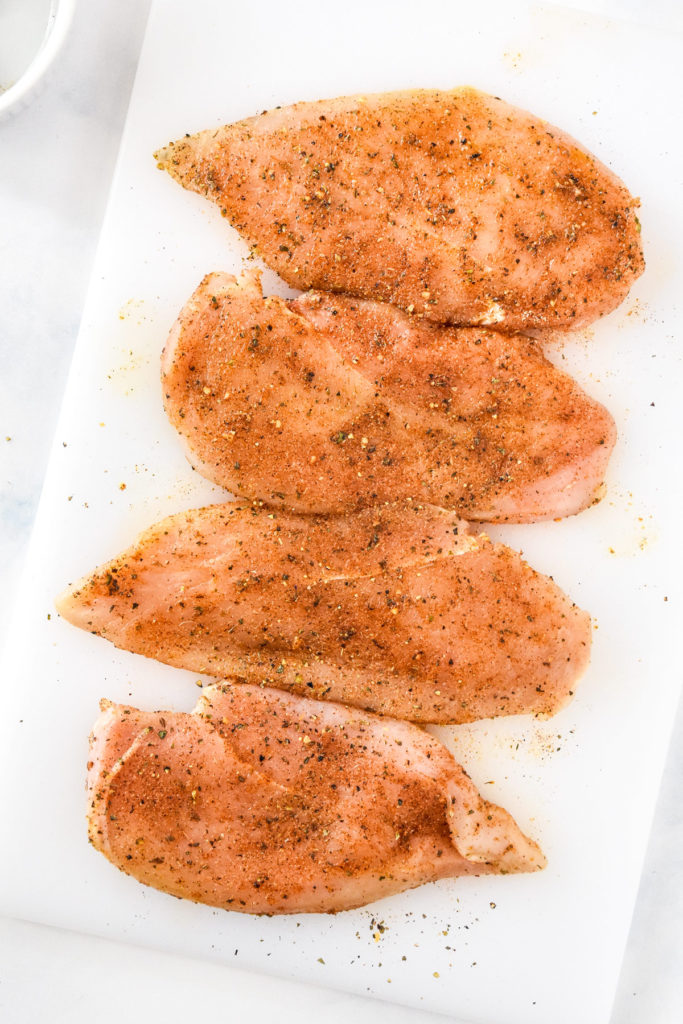 seasoned thin sliced chicken breasts before cooking.