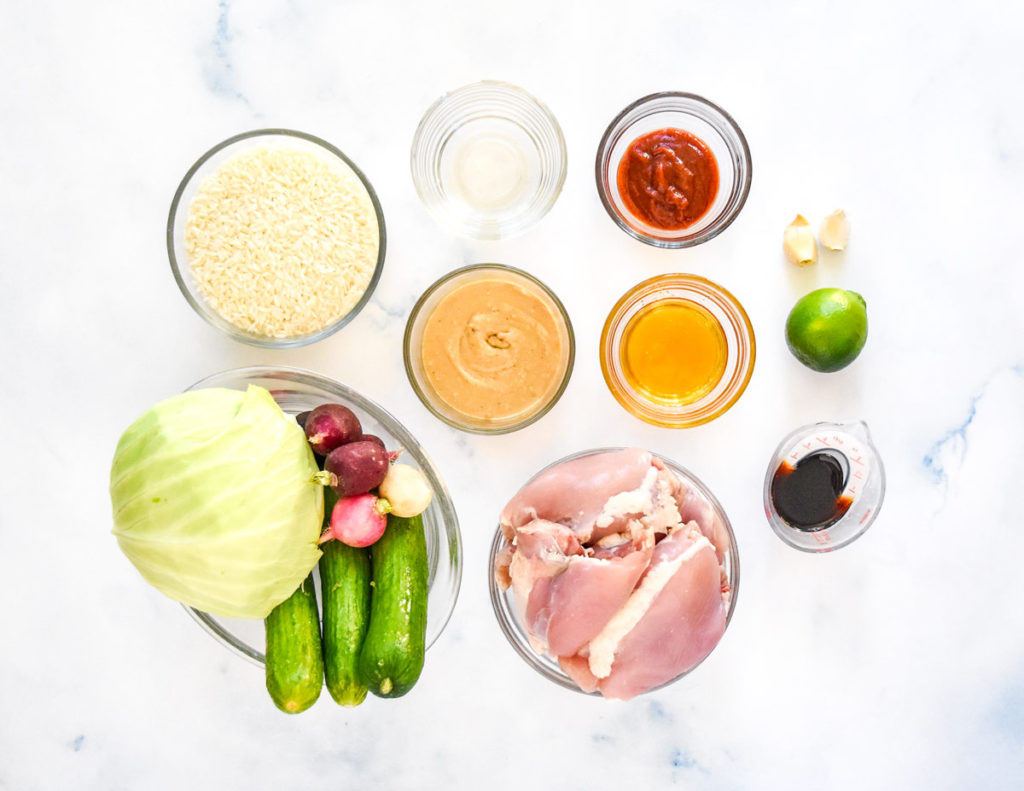 raw ingredients on a white surface before starting to cook.