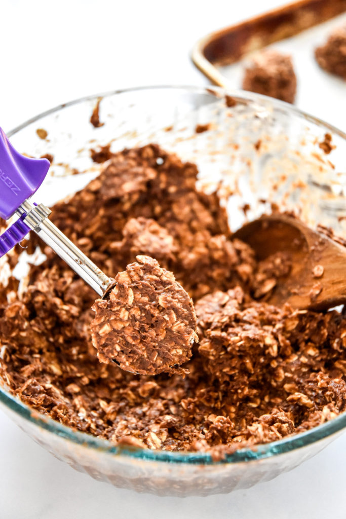 using a cookie scoop to portion the batter for the banana chocolate oatmeal mounds.