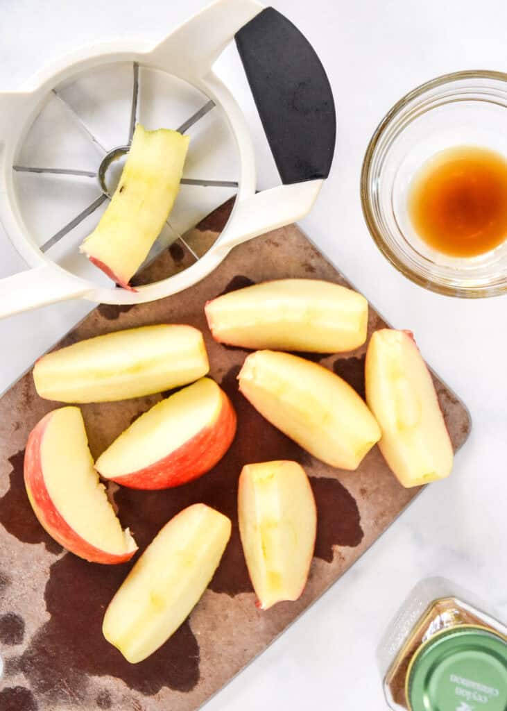 slicing apples on a cutting board.