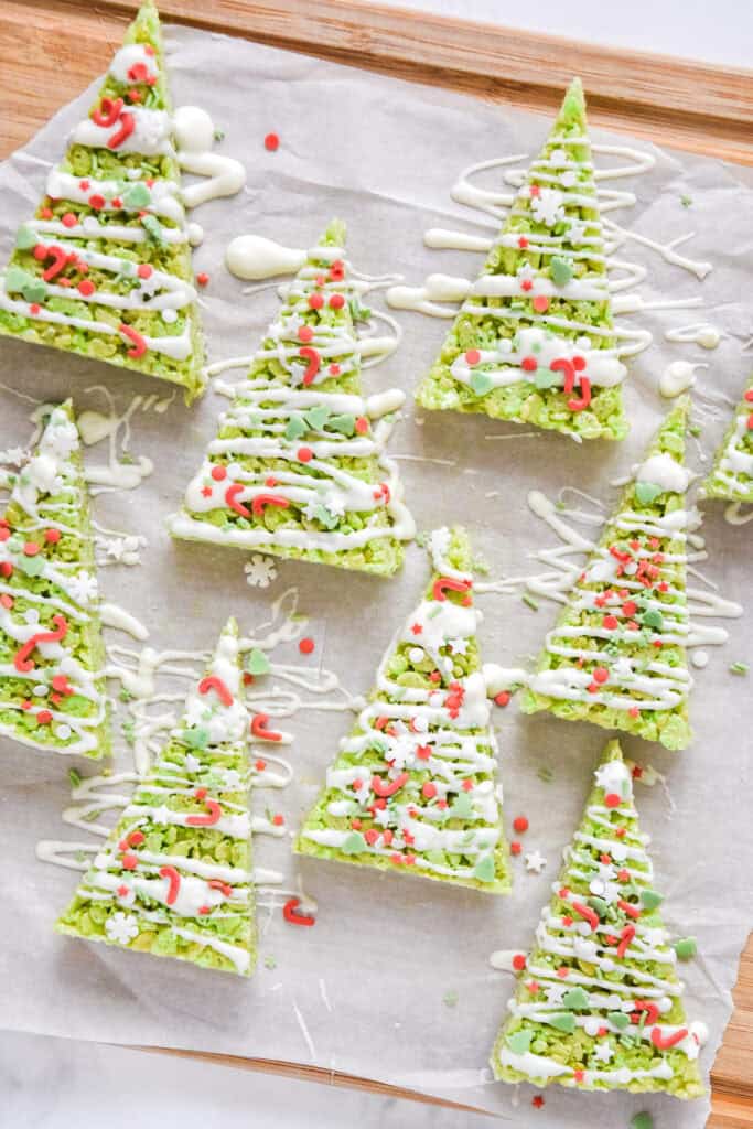 easy christmas tree rice krispies treats decorated with chocolate and trader joe's christmas sprinkles.