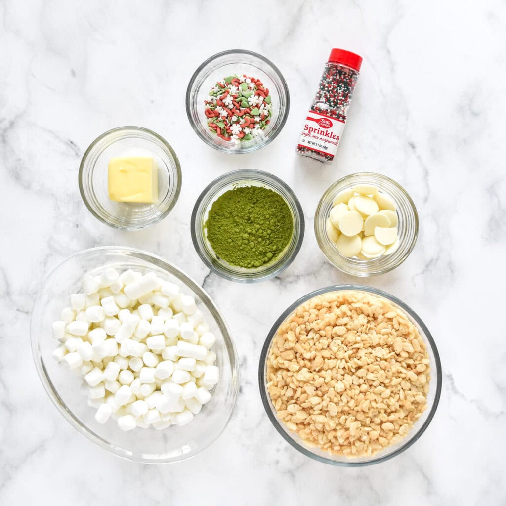 ingredients for making green rice krispies treats in glass bowls.