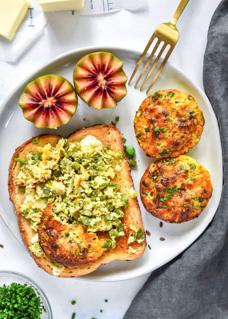 spring vegetable mini crustless quiches with toast and kiwis.