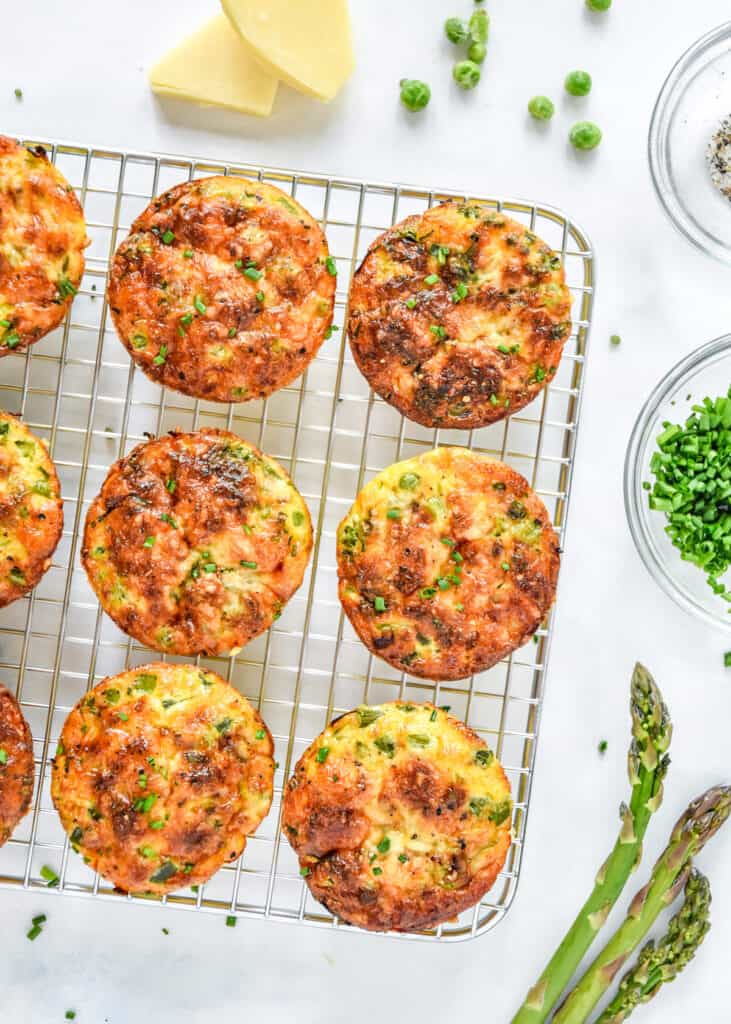 Spring Vegetable Mini Crustless Quiches cooling on a wire rack.