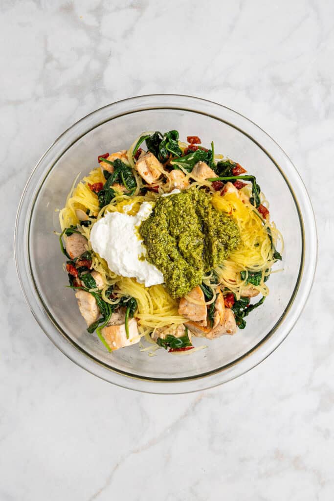 cooked chicken & vegetables with pesto and greek yogurt before stirring.