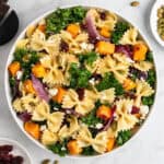 fall pasta salad with maple vinaigrette in a large white bowl.